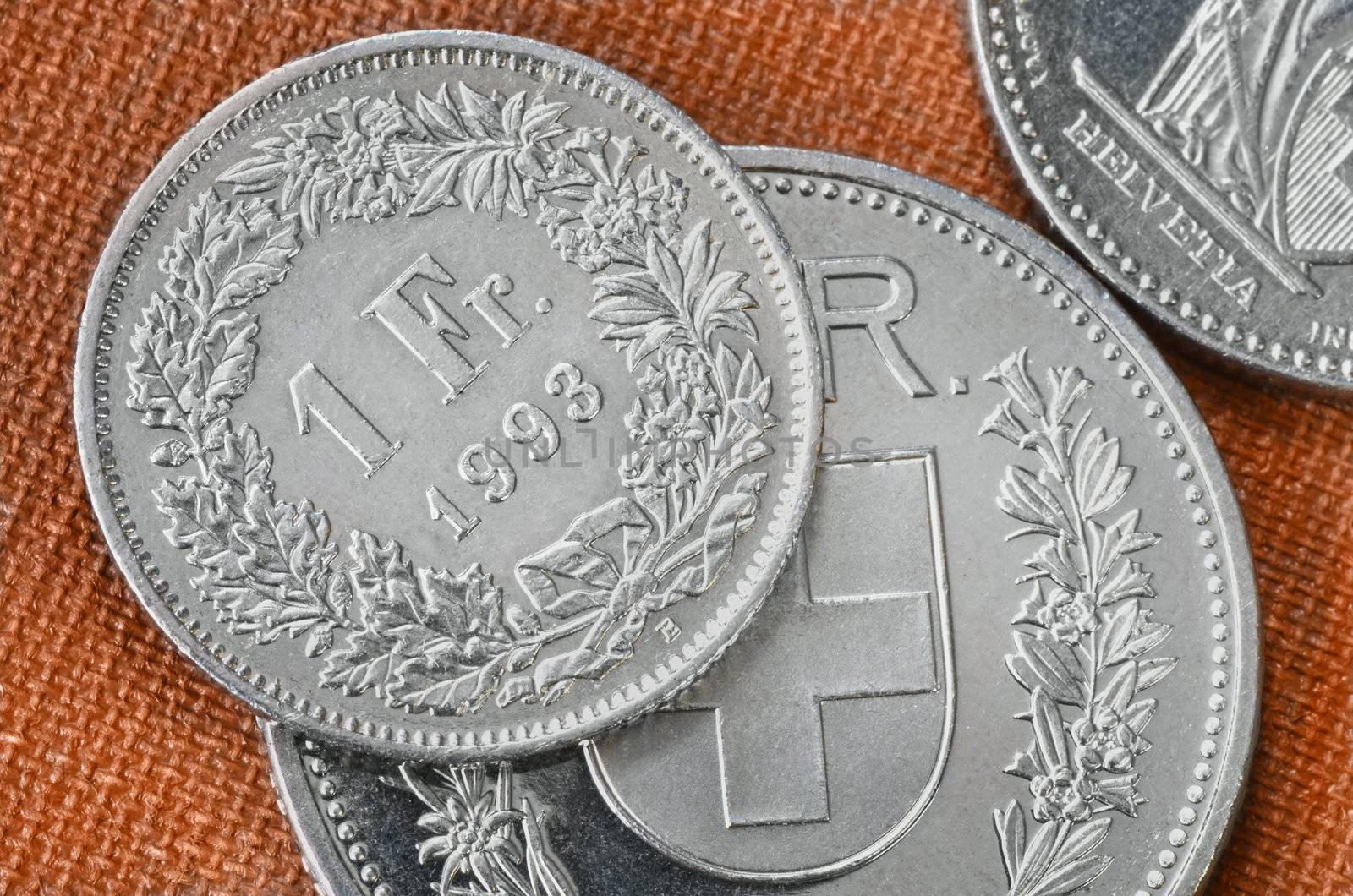 Swiss coins close up. One, and five francs coins.