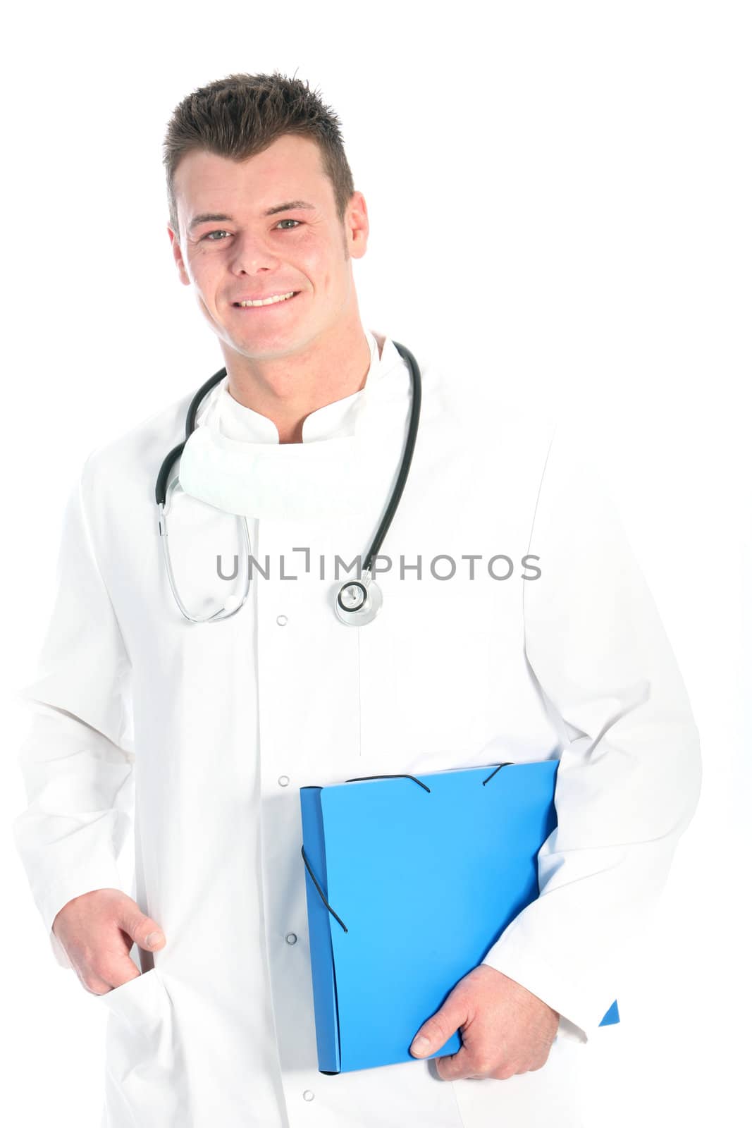 Smiling successful male doctor or physician standing in a white lab coat holding a folder under his arm isolated on white