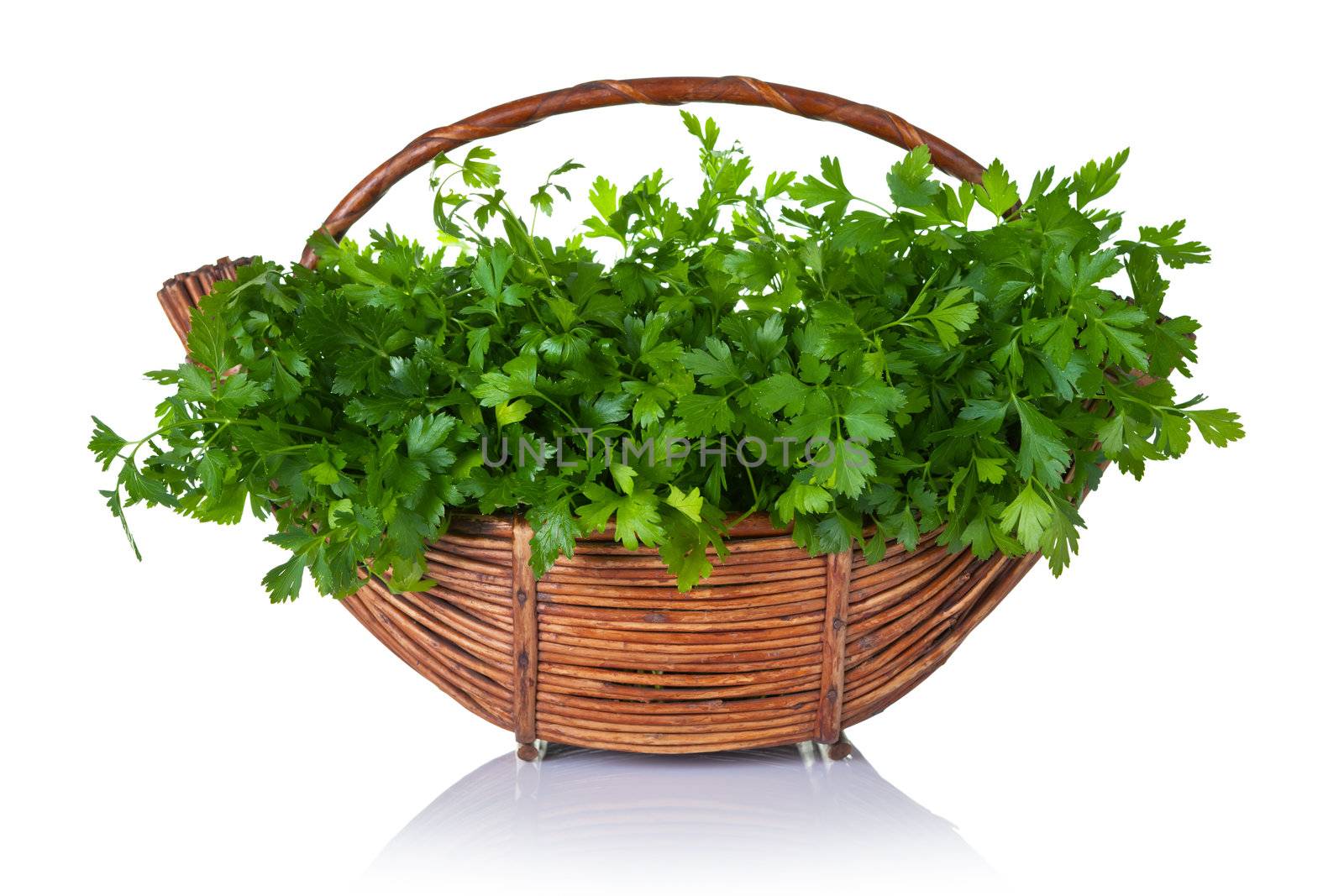 Fresh green parsley bunch in basket on white background 