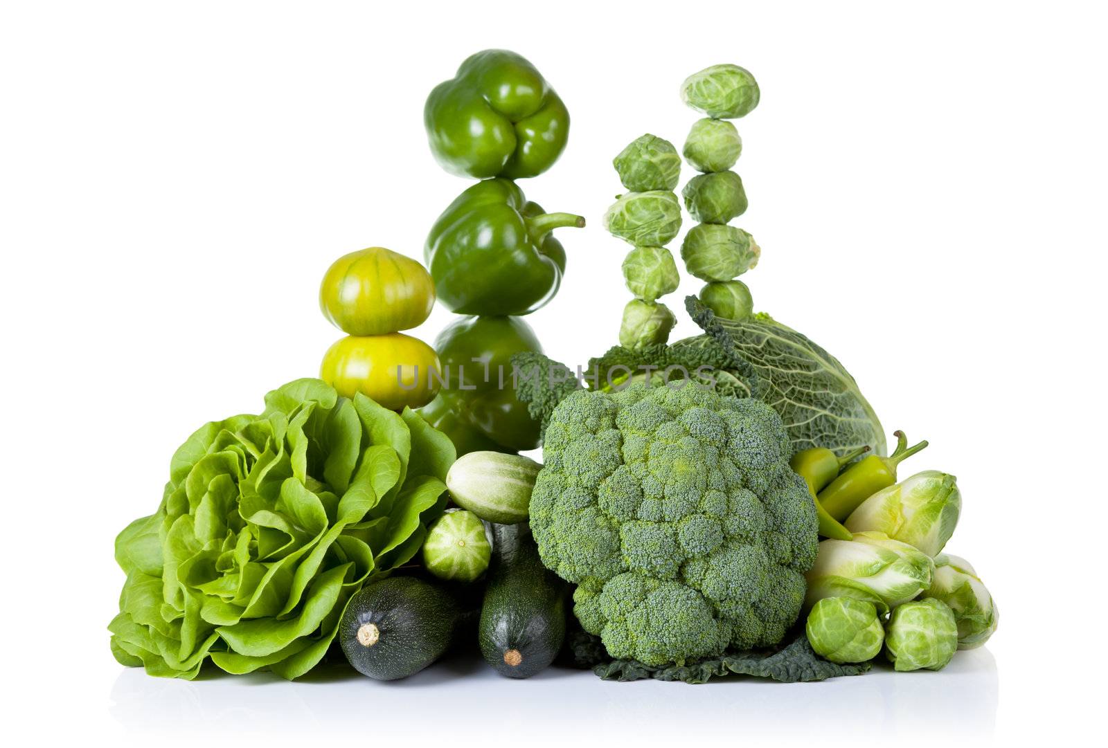 Fresh green vegetables isolated on white background