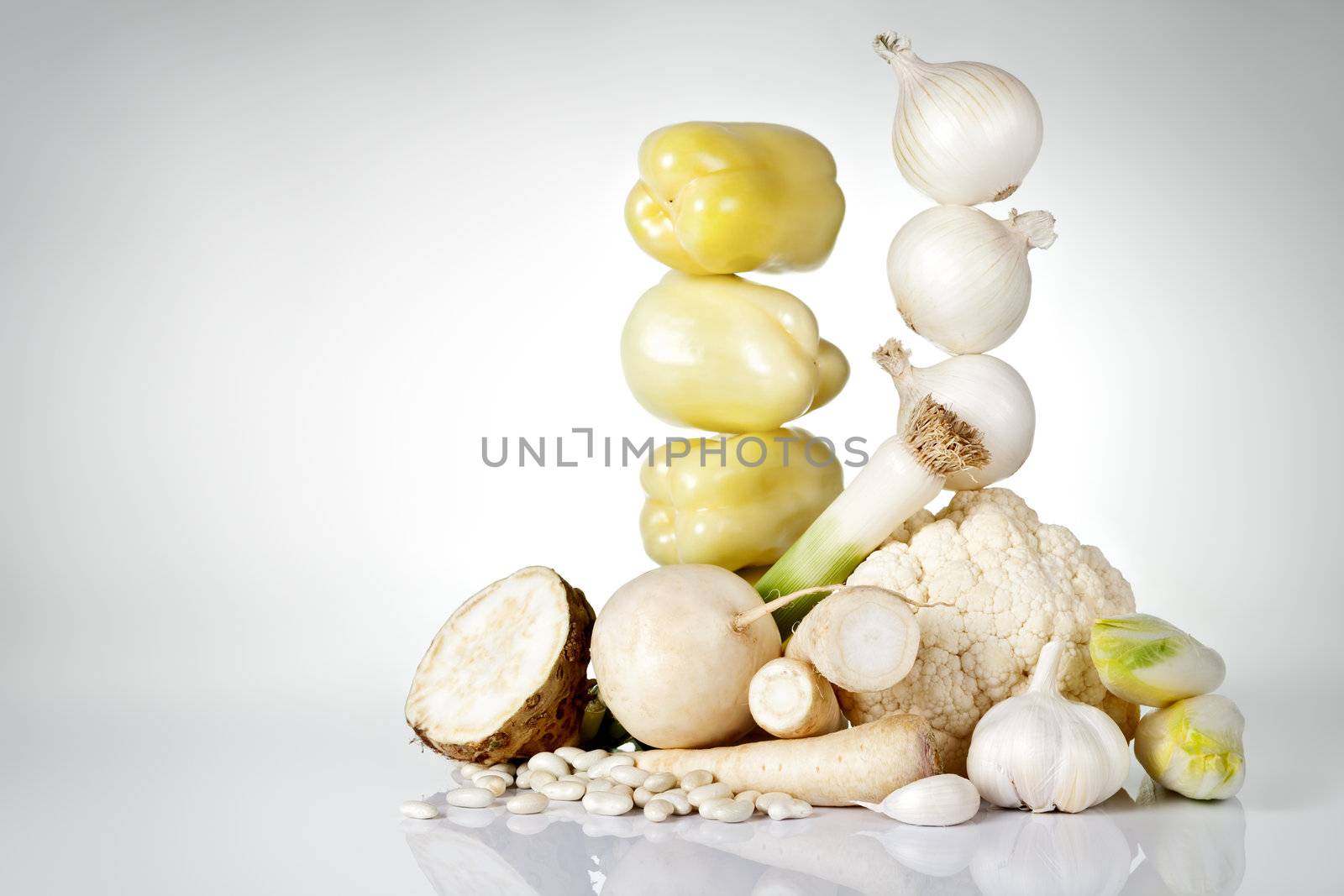 Fresh white vegetables on gray background with copy space