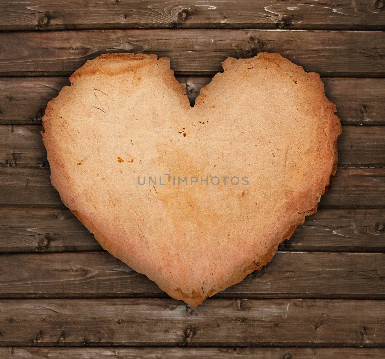 paper heart on a wooden table