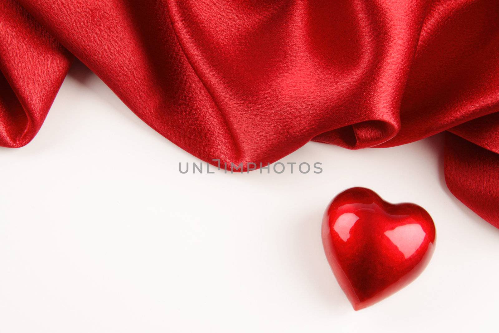 Valentine heart with red silk on white background