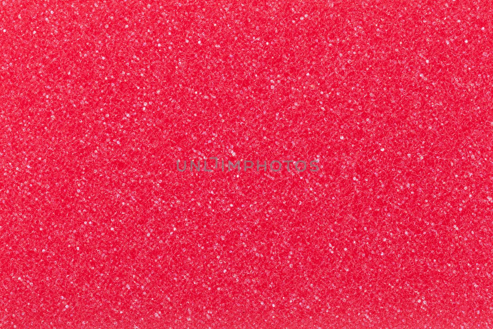 Red cleaning sponge texture for background. Top view