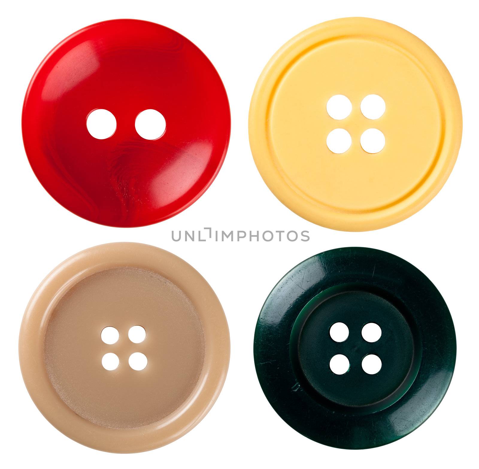 Four varied sewing buttons isolated on white background. Each one is shot seperately