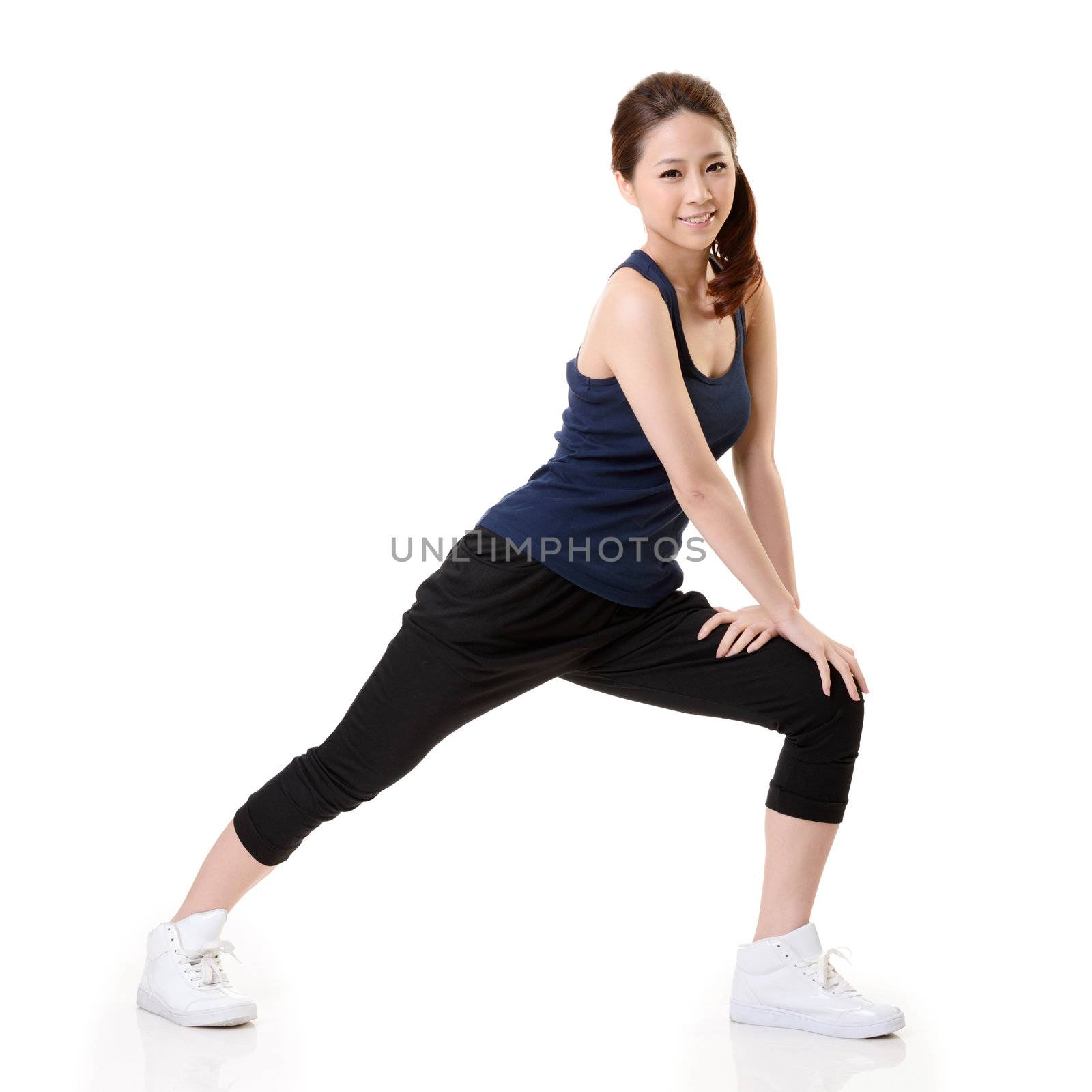 Sport girl of Asian doing stretch exercise, full length portrait isolated on white background.