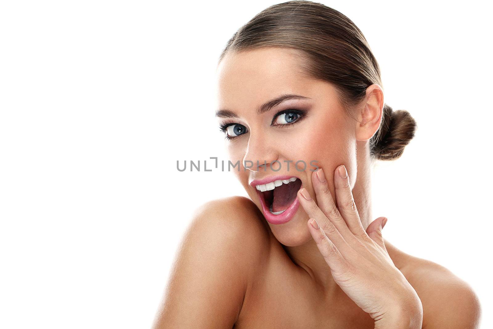 Young beautiful latino woman surprised over white background