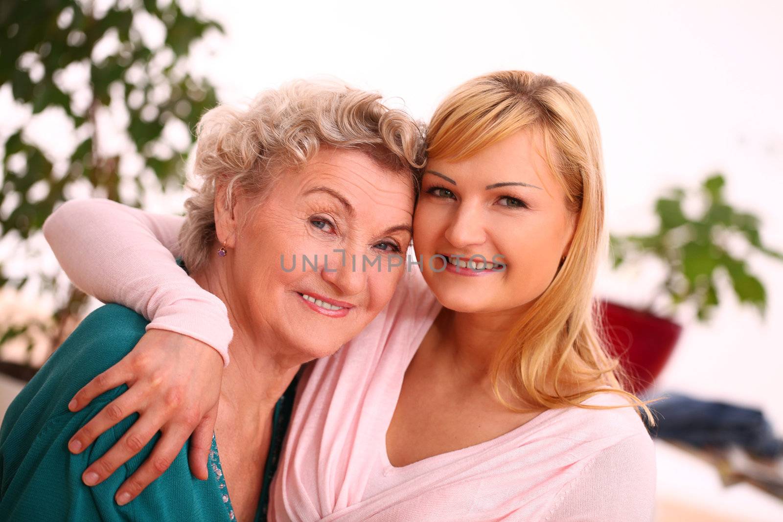 Happy elderly woman with granddaughter by rufatjumali