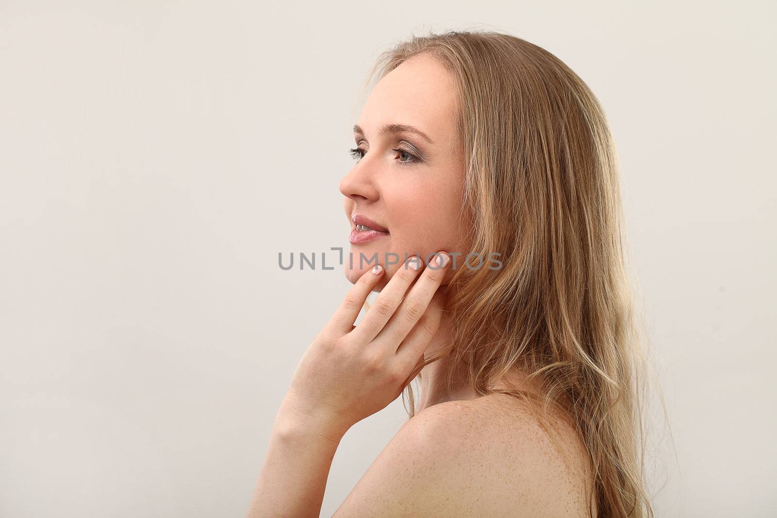 Young natural woman with clear face isolated over white background