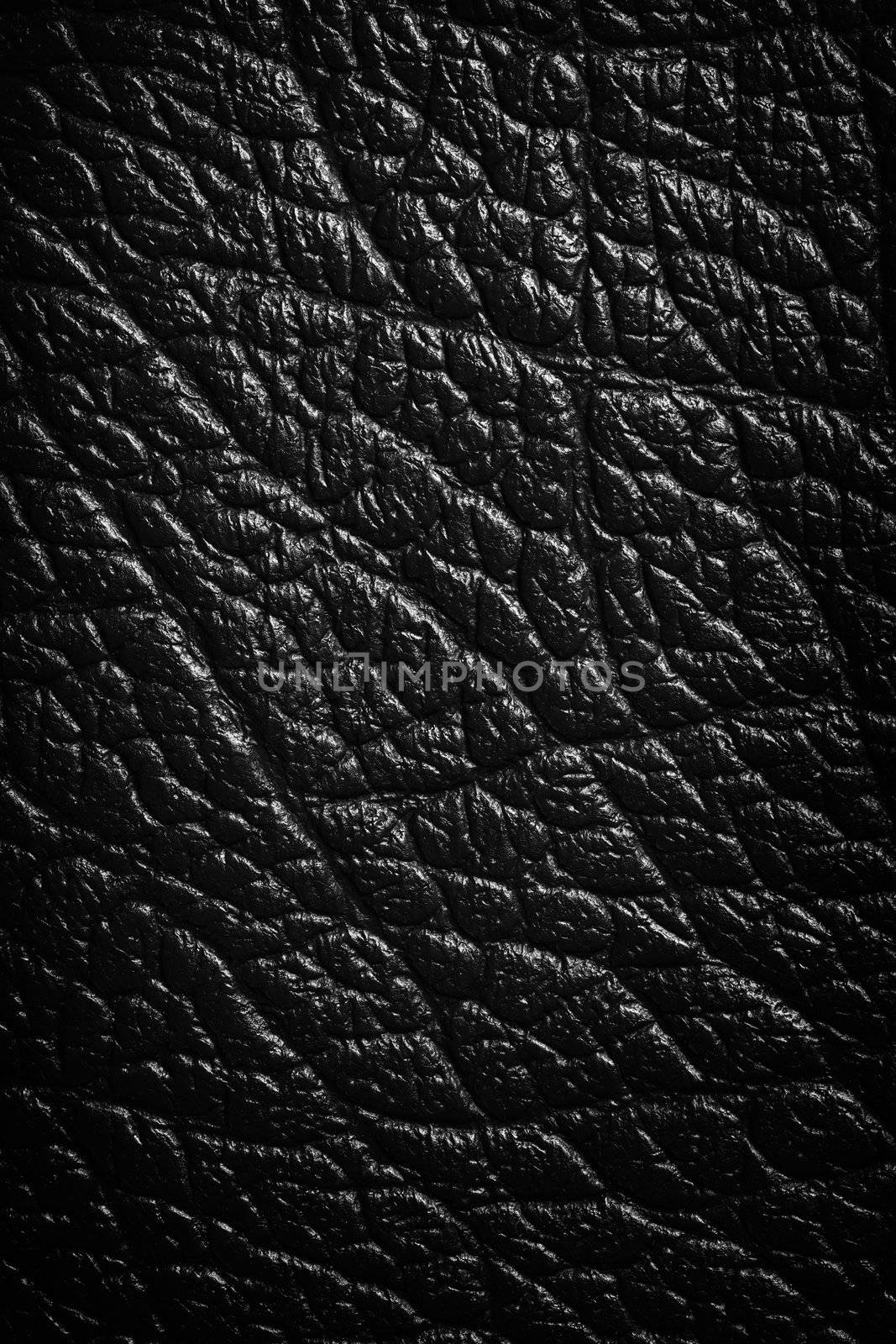 Black leather texture or background. Close up, top view