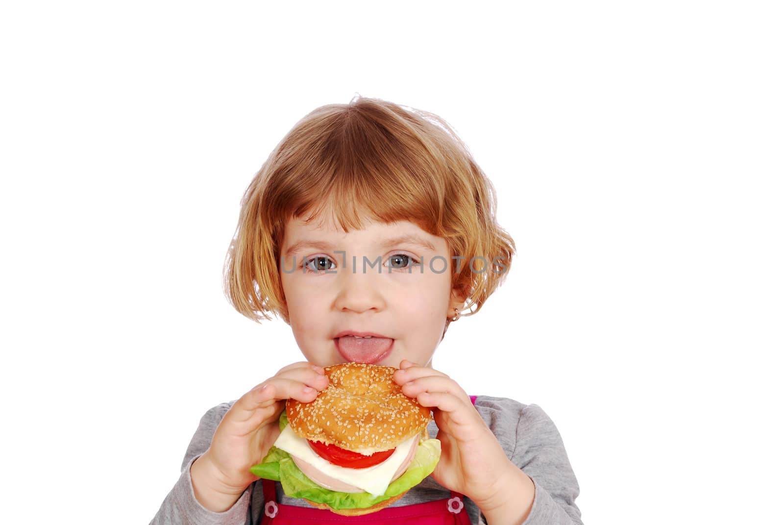 Beauty little girl eating sandwich