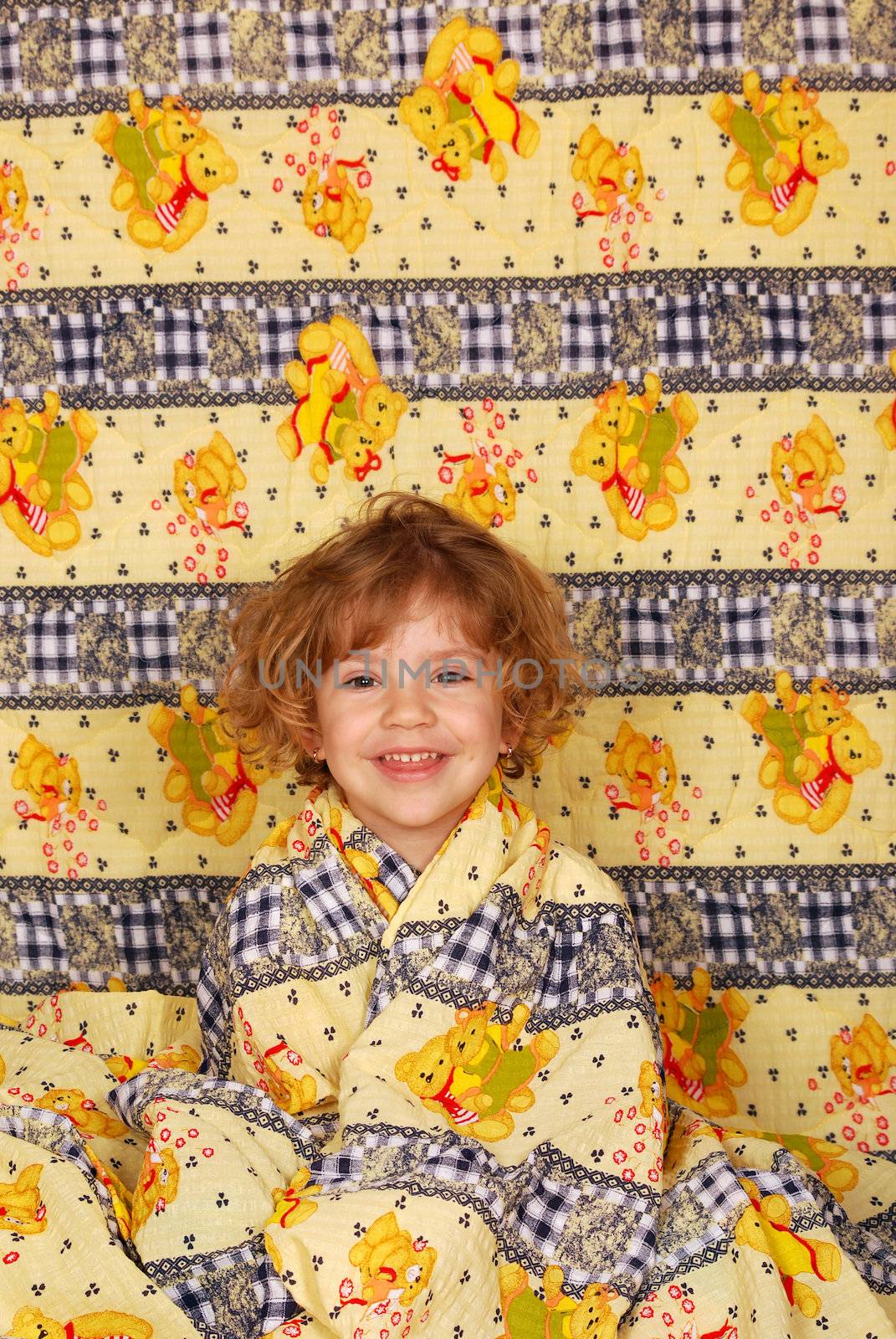 Little girl in colorful linen studio shot