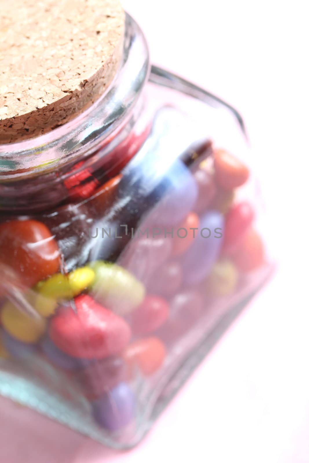 colorful chocolate drops in a glass beverage