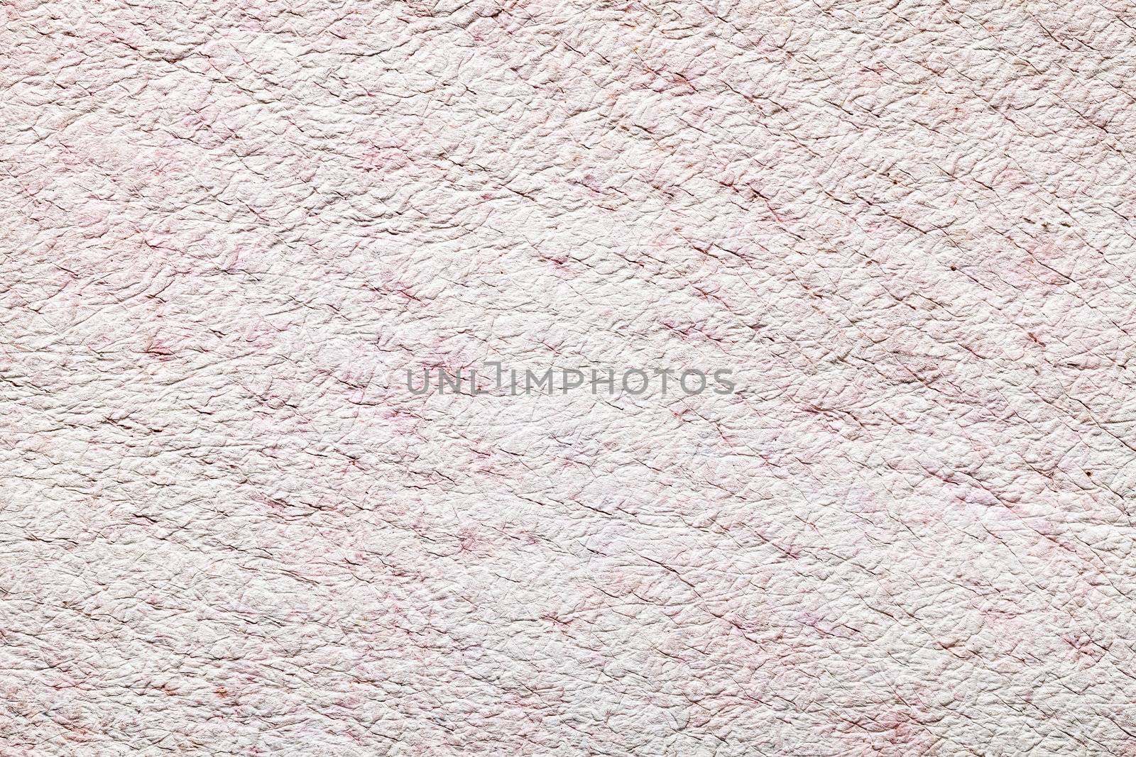Light pink leather texture for background . Macro shot