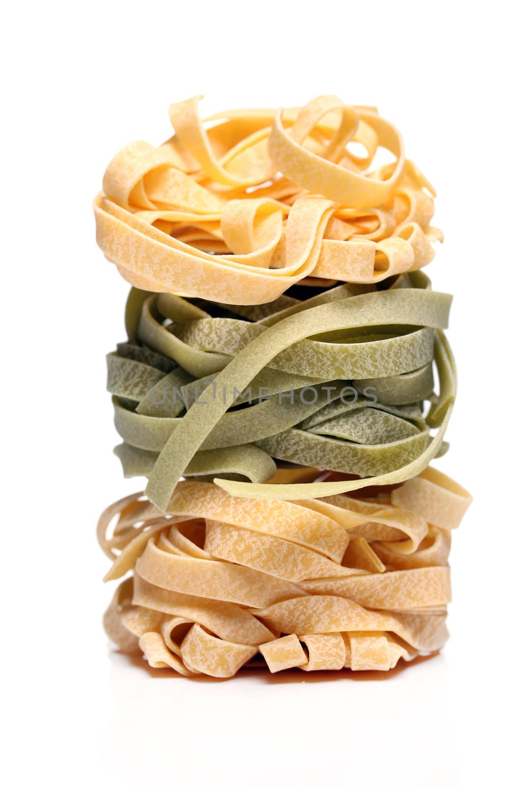 Fresh and tasty tagliatelli isolated over white background