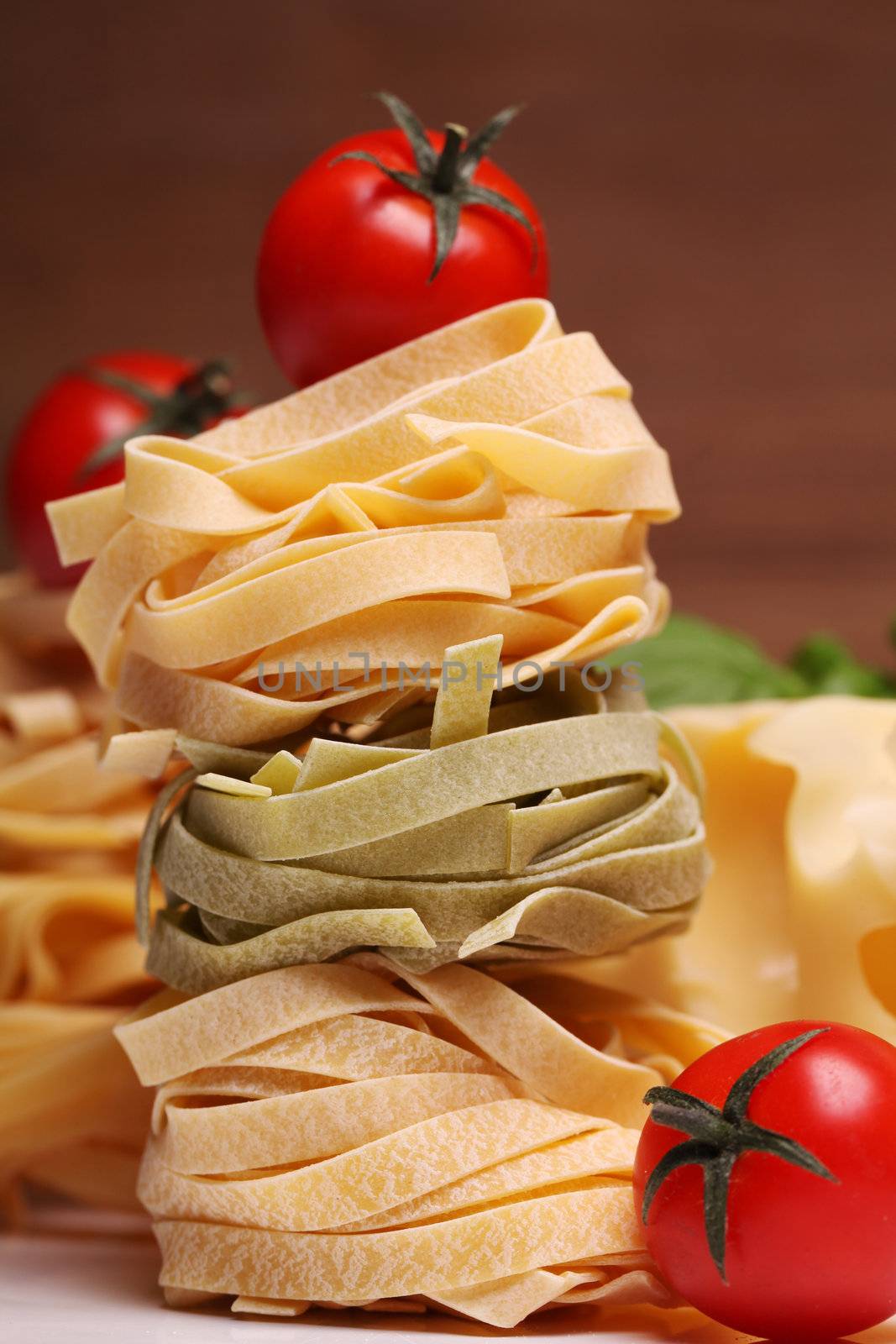 Fresh ingredients for pasta isolated on wooden background