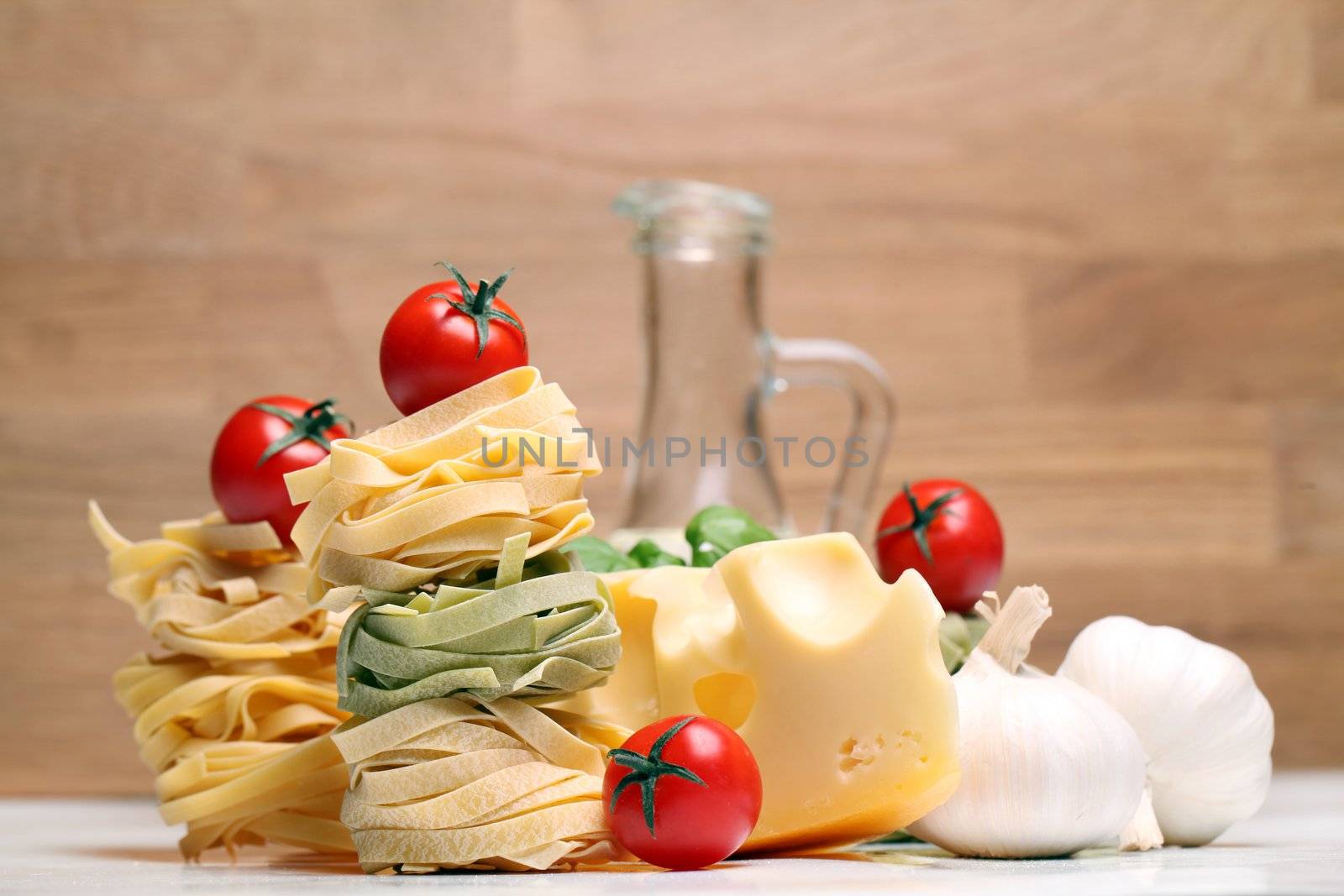 Fresh ingredients for pasta isolated on wooden background