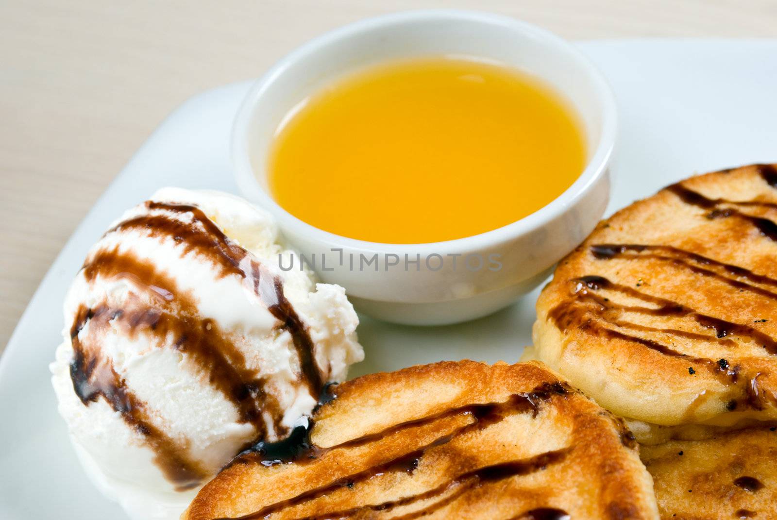 morning meal.pancakes with icecream and honey