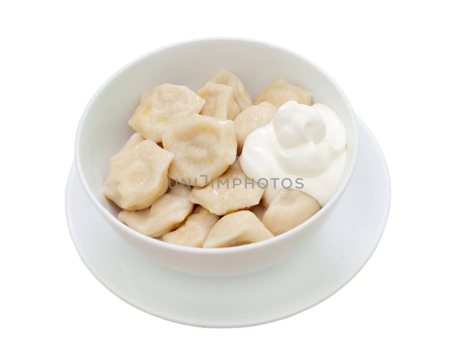 Traditional Russian food "pelmeni".Meat dumplings  with sour cream