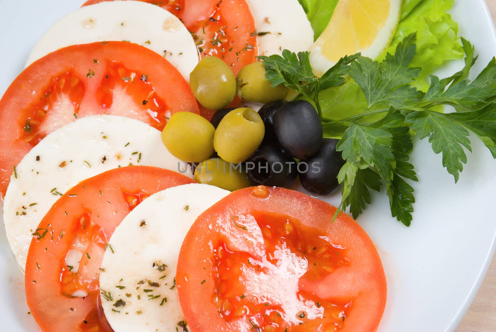 Arrangement of mozzarella and tomatoes.Italian kitchen.