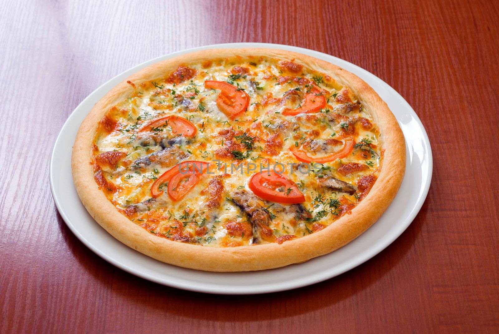 Pizza and italian kitchen. Studio. ,Close-up.tomatoes,sprats