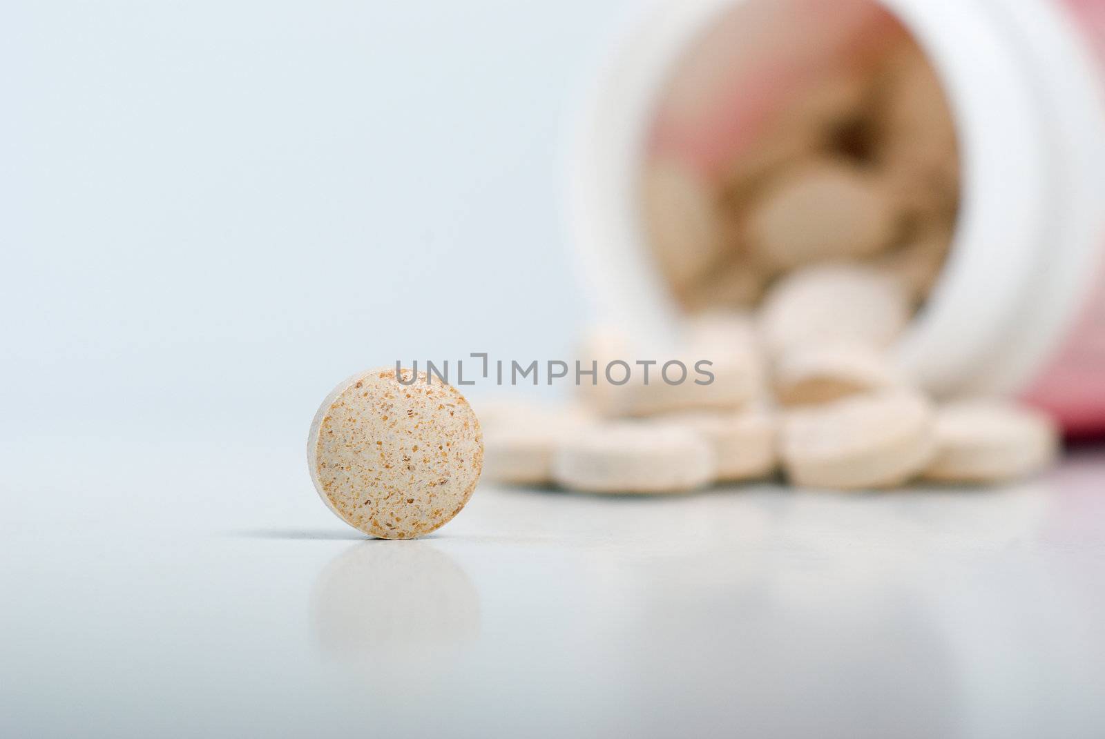 Pills spilling out from a prescription bottle,Prescription Drugs
