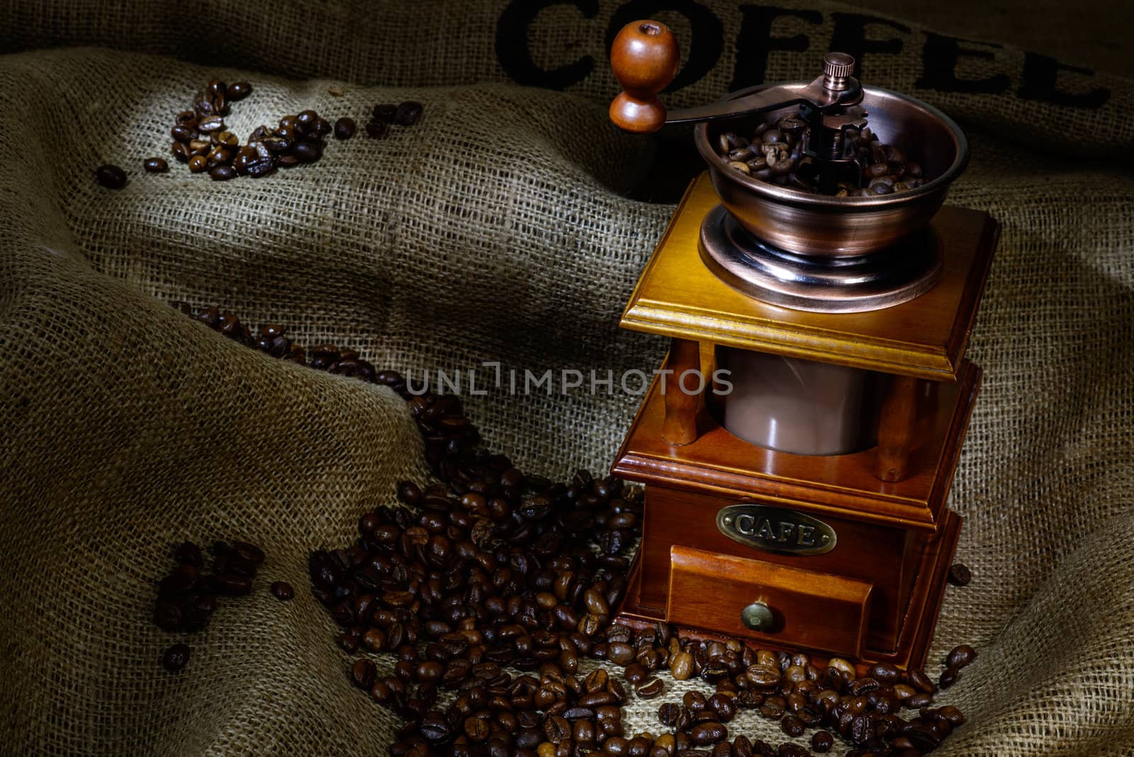 Coffee Mill with beans and burlap. still life