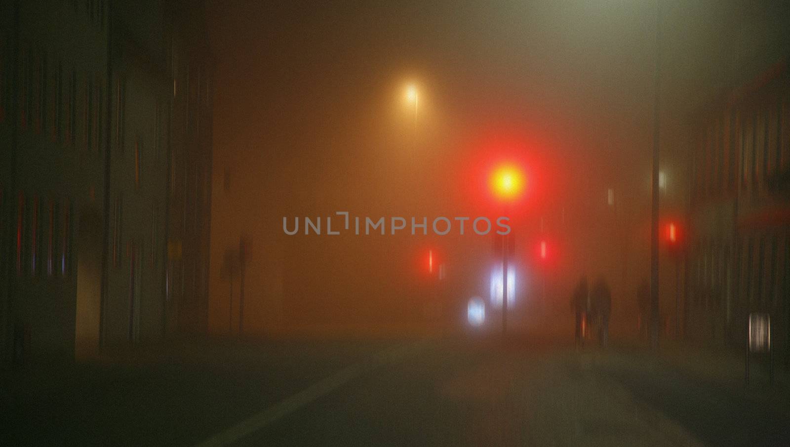 Cyclists in the foggy night - Denmark. Blurred capture - filmgrain added to improve the atmosphere.