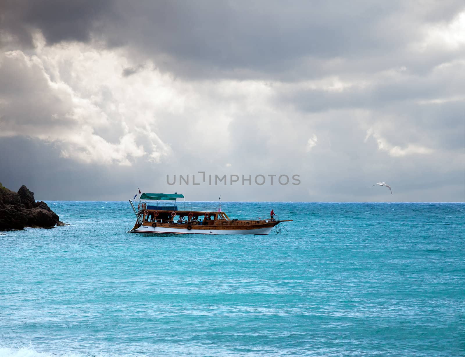 boat in the sea and stormy sky