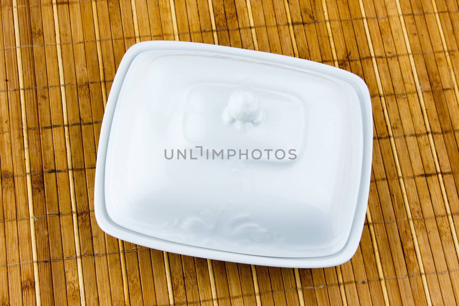 oval dish for butter on a bamboo napkin