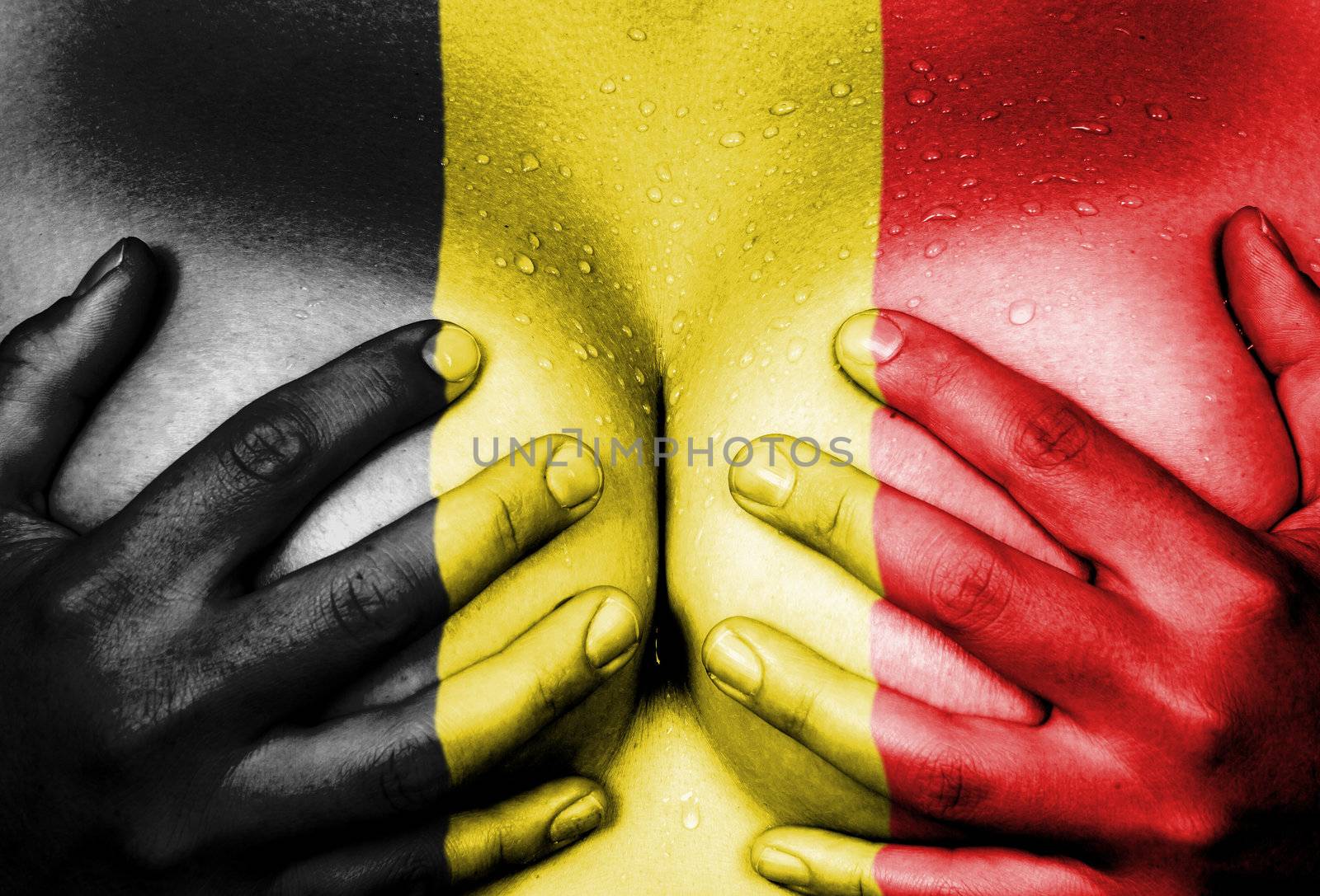 Sweaty upper part of female body, hands covering breasts, flag of Belgium
