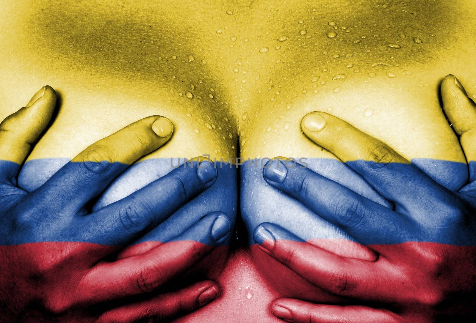 Sweaty upper part of female body, hands covering breasts, flag of Colombia