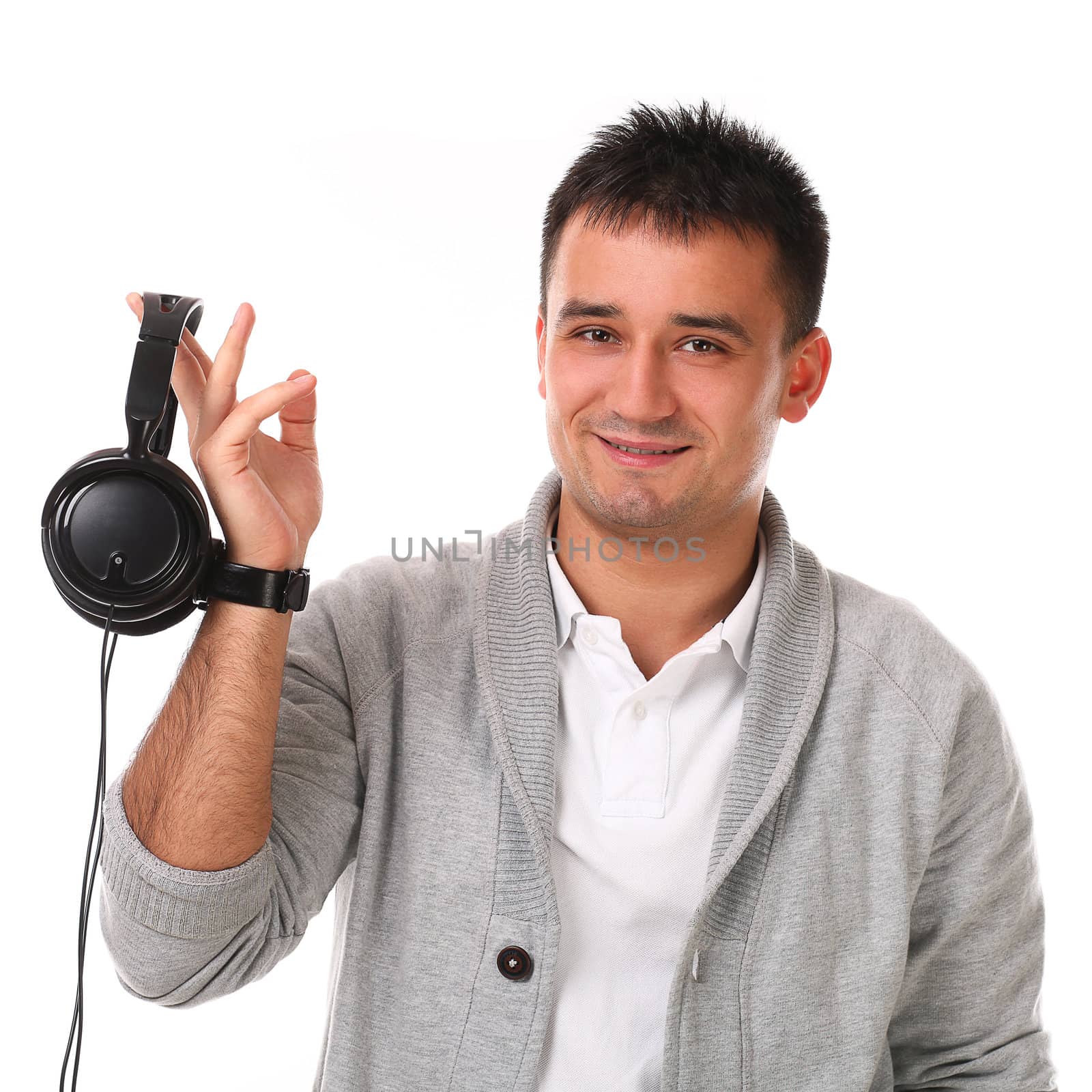 Young handsome man with headphones isolated over white background