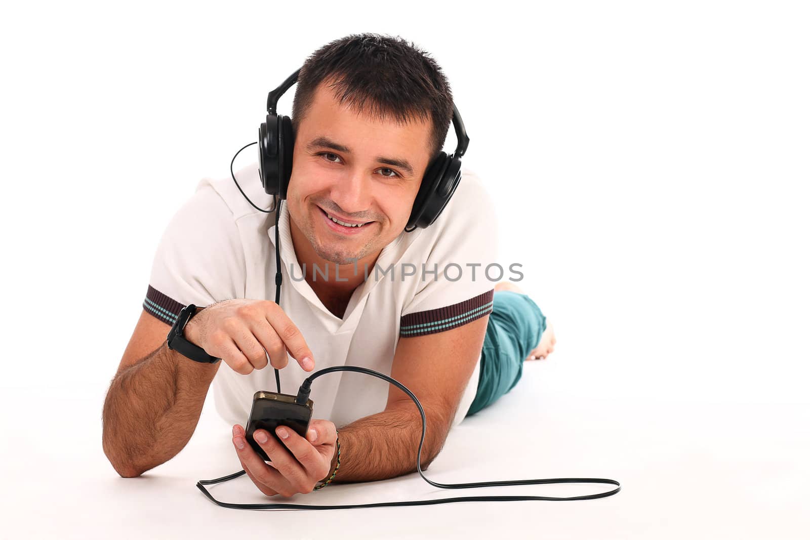 Young handsome man with headphones isolated over white background