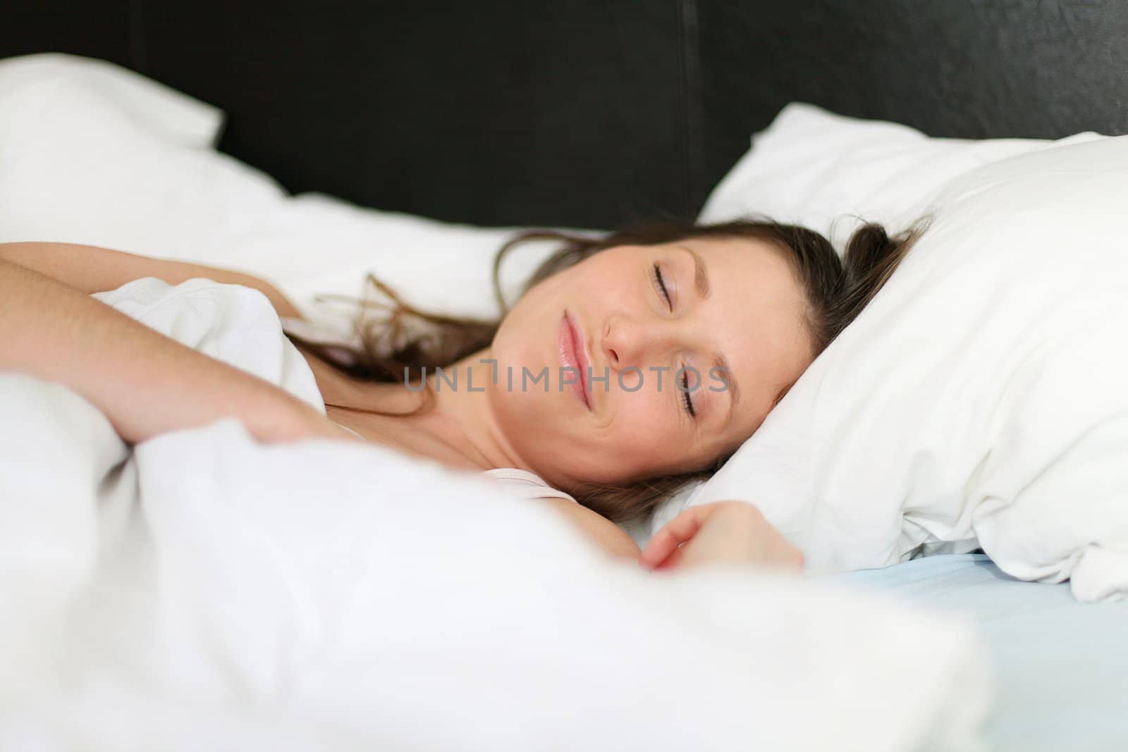 Young beautiful caucasian girl in bed