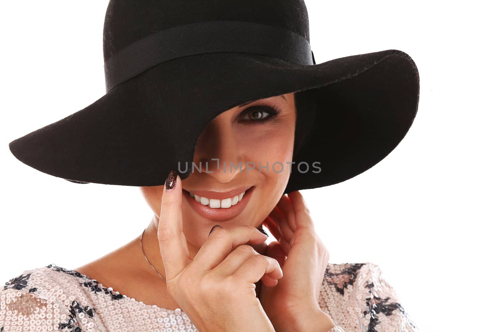 Young beautiful woman in hat and dress isolated over white background