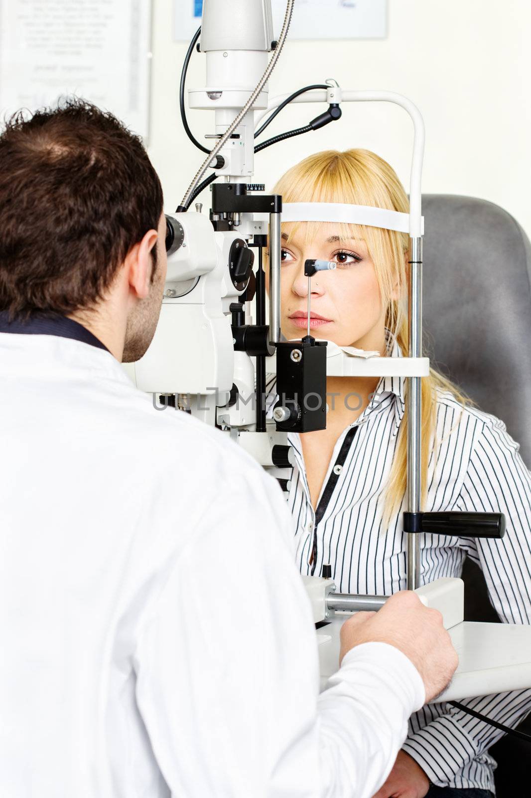 Eye doctor performing an eye examination