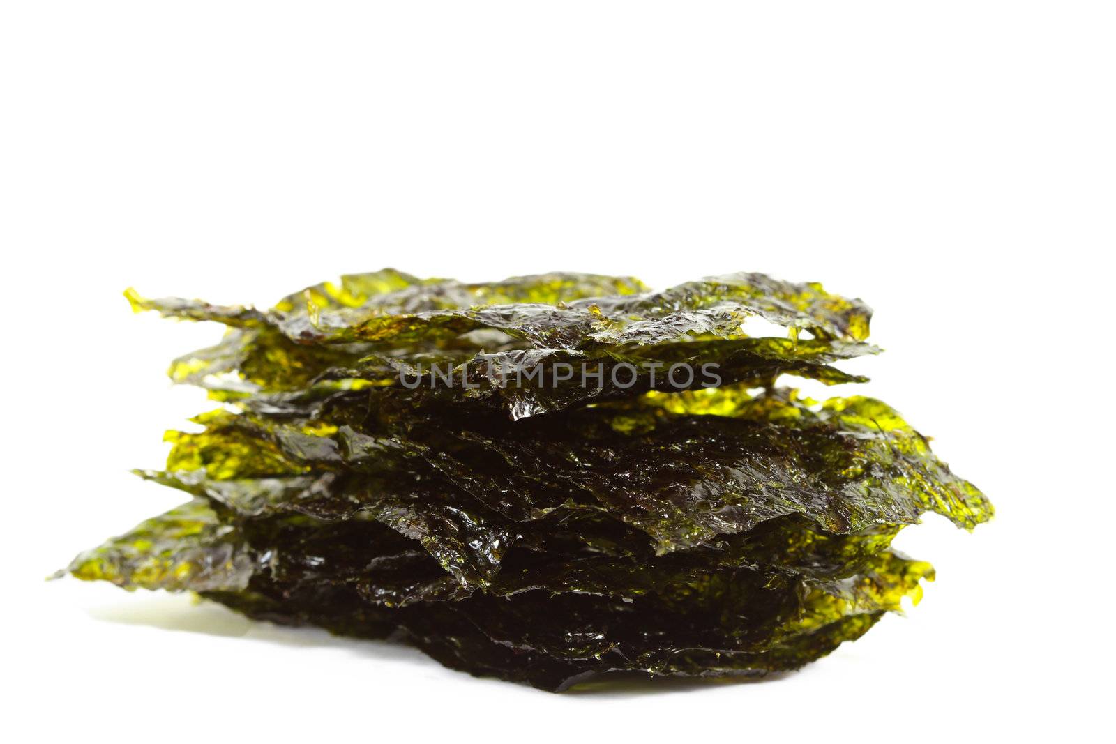Isolated dark green sheets of a salted nori sea weed on the whit by bajita111122