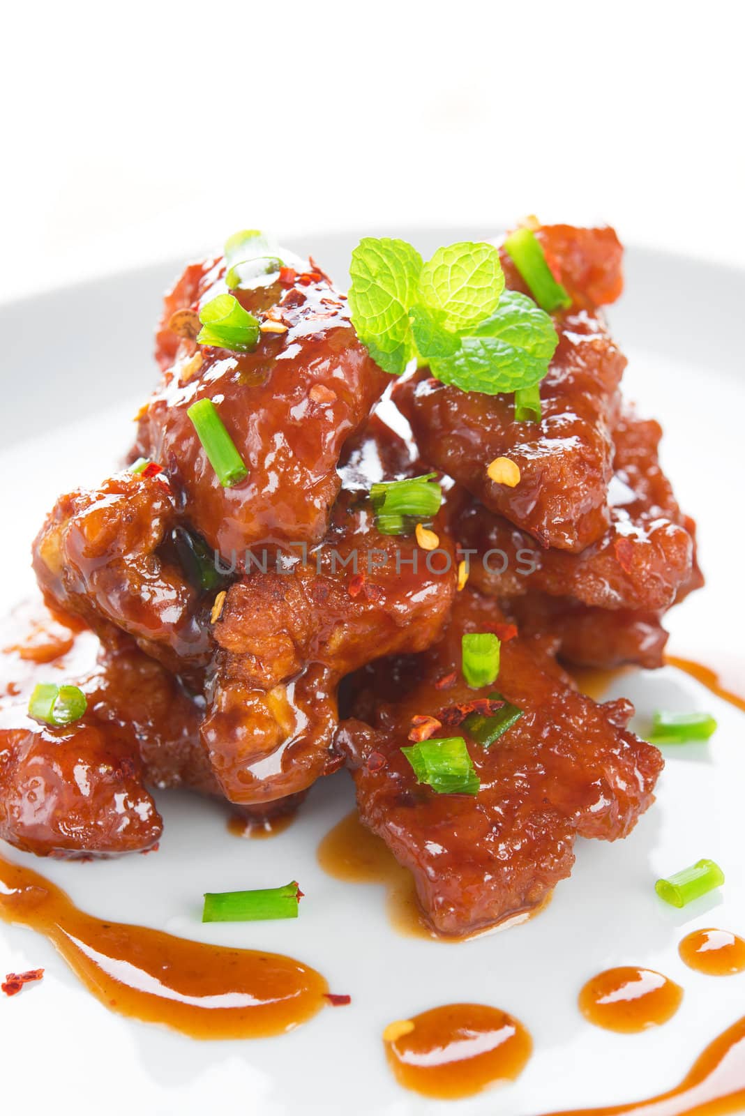 Chinese spare ribs cuisine dish, close up delicious Asian food ready to serve in plate.
