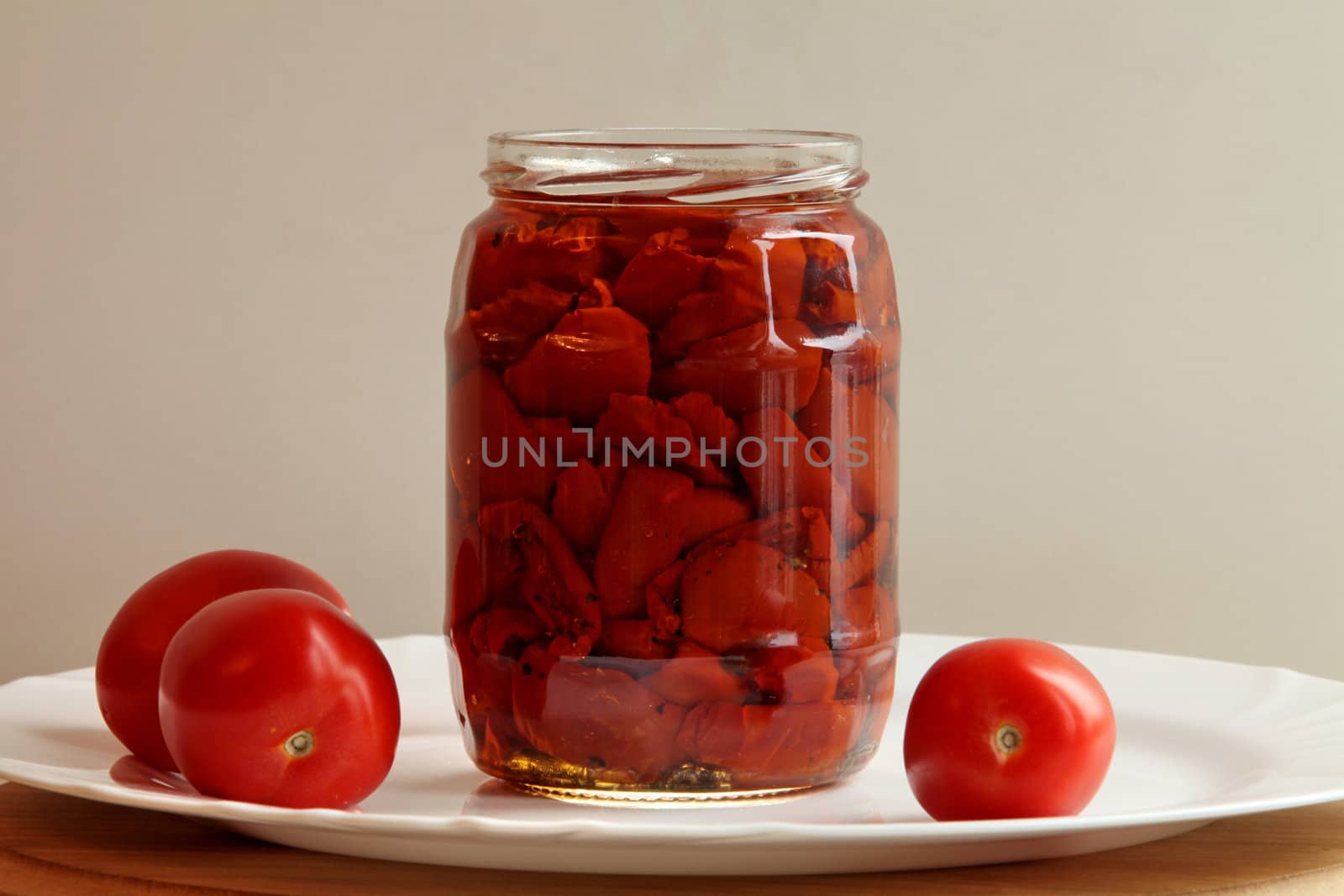 canned tomato  with three  tomatoes