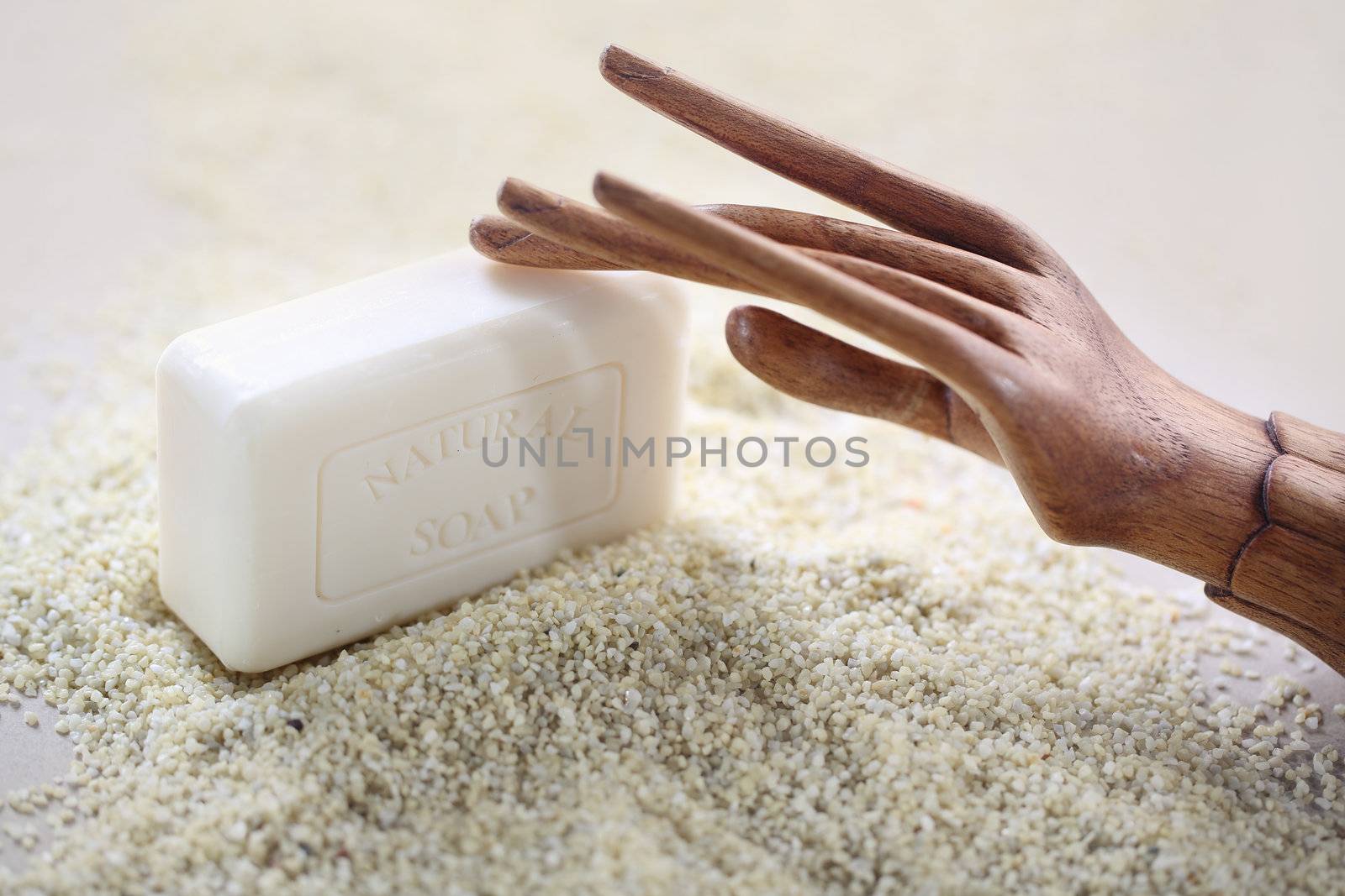 Wooden hand on piece of soap by robert_przybysz