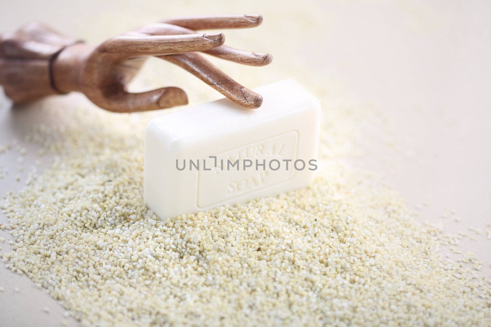 Wooden hand on piece of soap by robert_przybysz