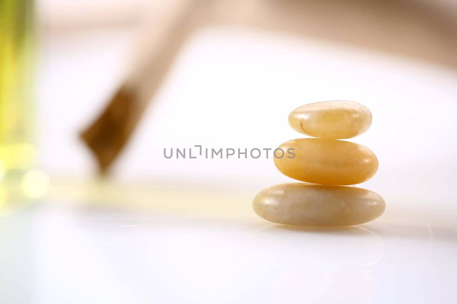 Three gold stones on white background