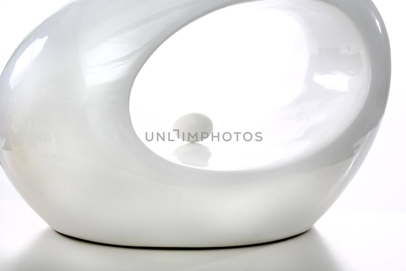 White oval shape on white background