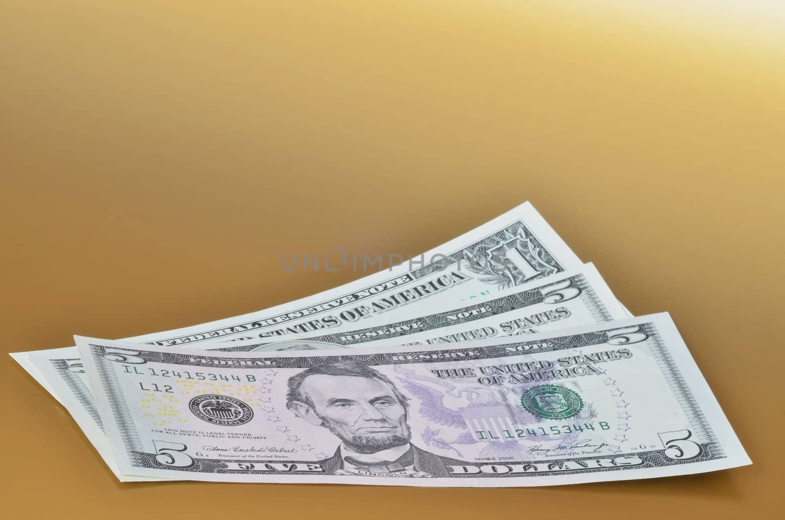 Eleven american dollars on golden background