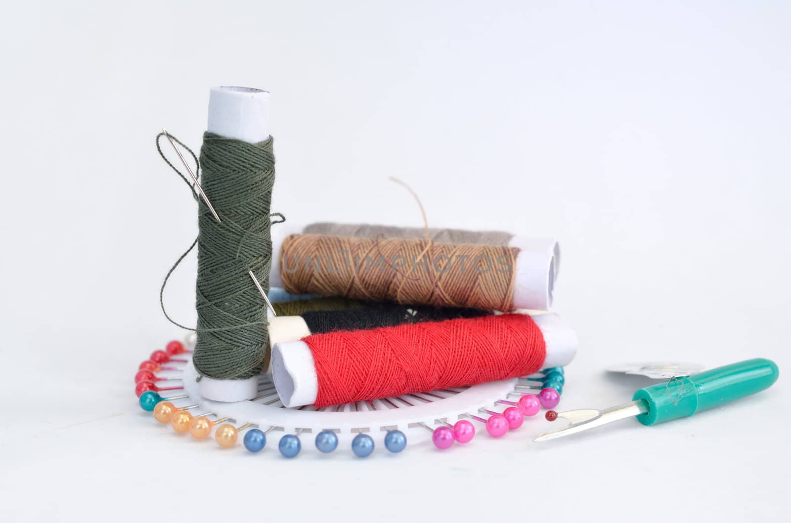 sewing accessories with pins, needle and thread