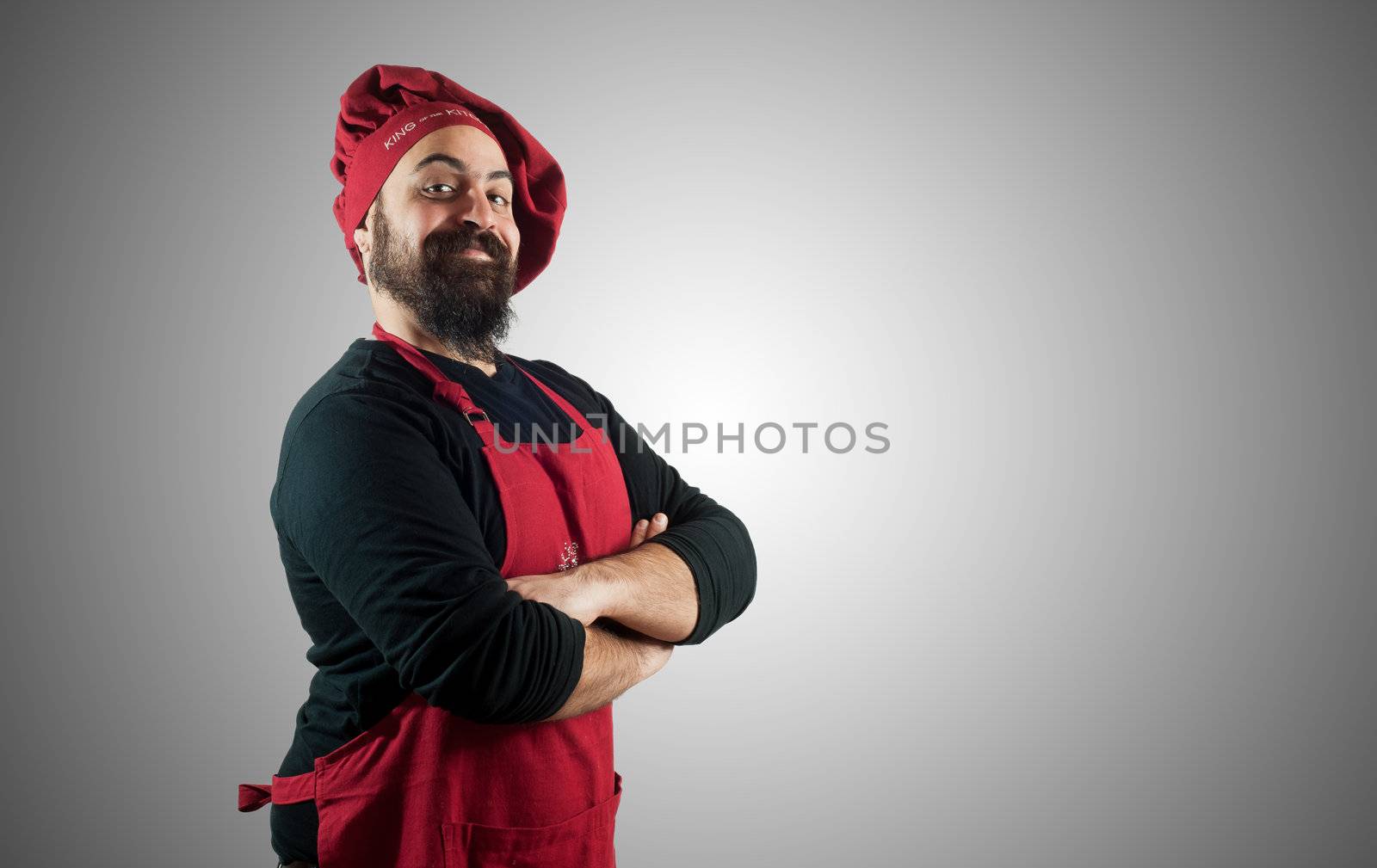 hppy bearded chubby chef on grey background