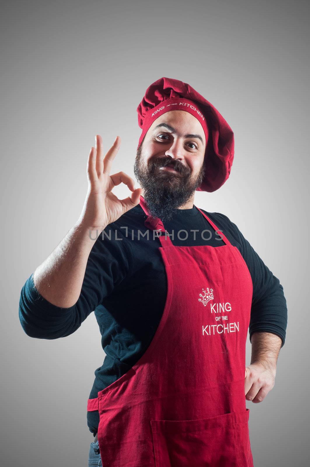 hppy bearded chubby chef on grey background