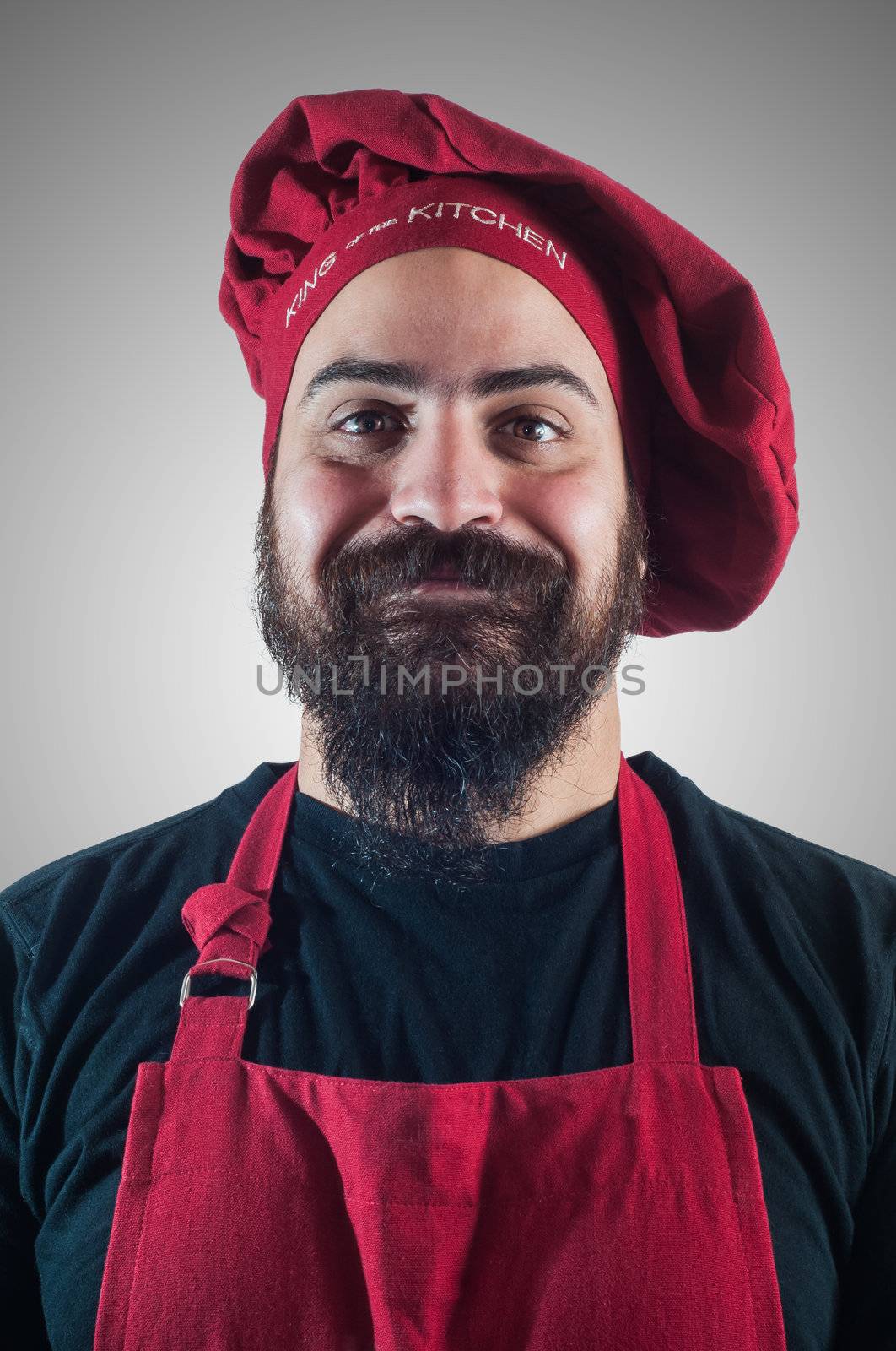 hppy bearded chubby chef on grey background