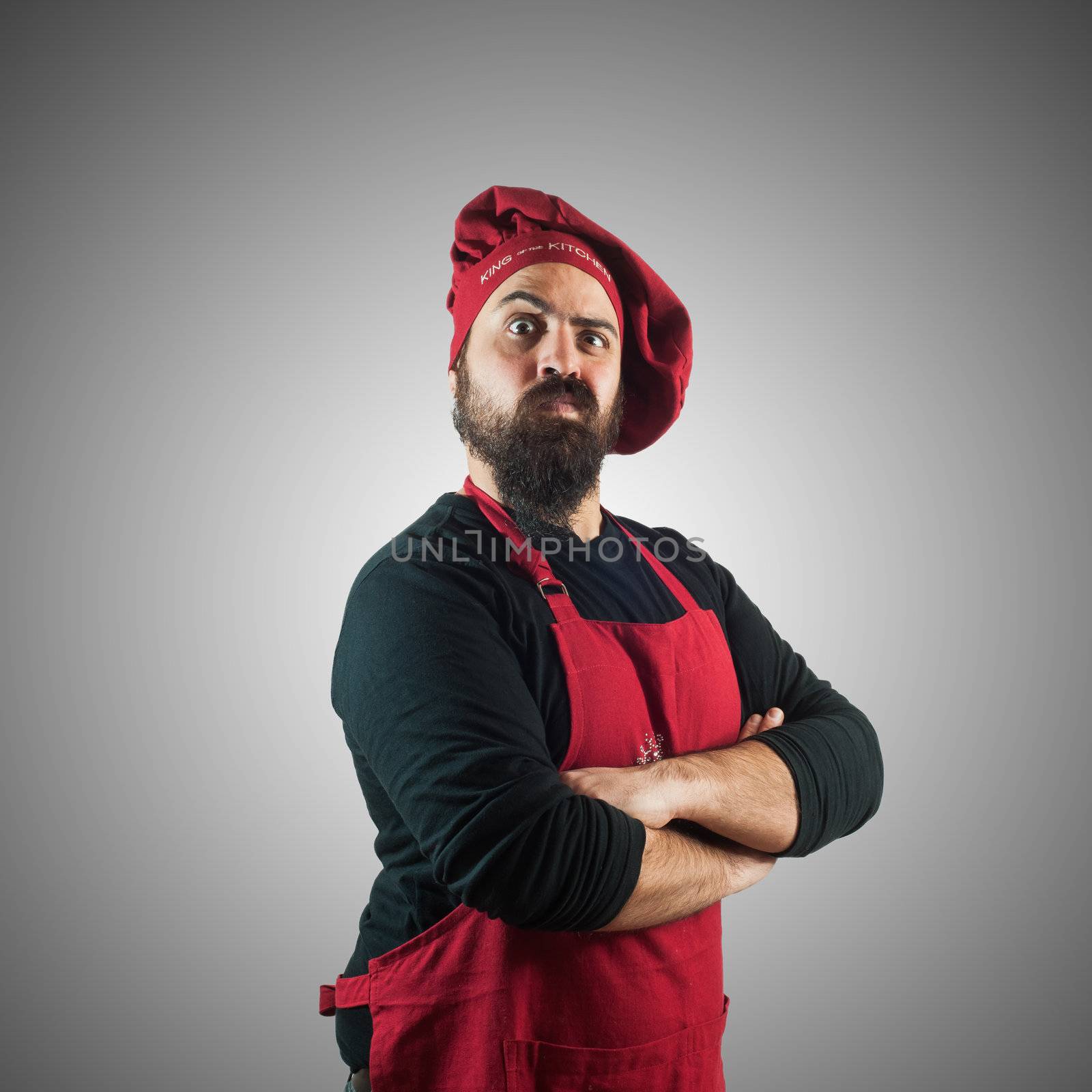 doubtful bearded chubby chef on grey background